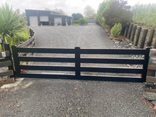 Load image into Gallery viewer, Black aluminium gate on a driveway with a house and trees in the background
